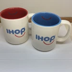 (2) Rare Ihop Restaurant Smiling Face Mug Coffee Cup 12OZ Red & Blue. Fixed Price $22.99.