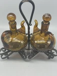 Amber Glass Cruet Set W/ Wrought Iron Holder. Fixed Price $6.00.
