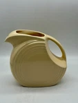 Vtng. Butter Yellow Fiesta Disk Pitcher 7 64 Oz Usa Homer Laughlin. Fixed Price $24.00.