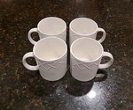 Set 4 Oneida Picnic Off White 12 Oz Mugs. Raised Basket Weave Pattern. Fixed Price $24.95.