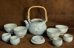 Ichi Tea Pot W/ 4 Bowls, Cups Blue Plum Tree Floral Ratan Handle Set Japan. Fixed Price $55.00.
