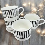 Vtg Aim 1998 Albert Elovitz Black White Piano Keys Porcelain 8OZ Mugs Cups Set 4. Fixed Price $40.00.